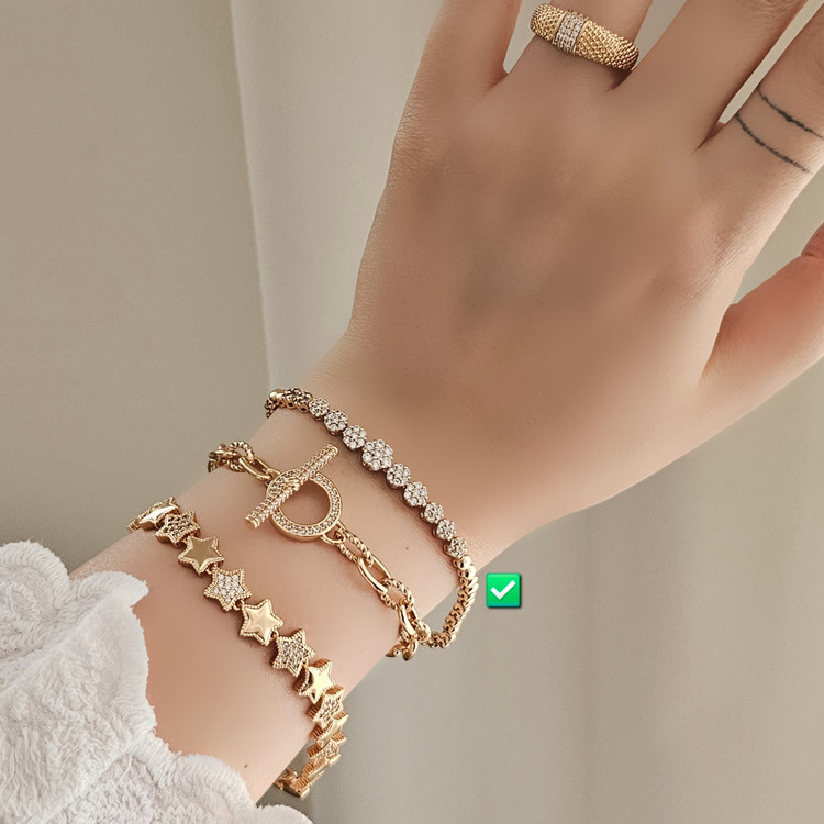 دستبند نگبندار طلایی برند ژوپینگ اصل و ضد حساسیت با حک برند
